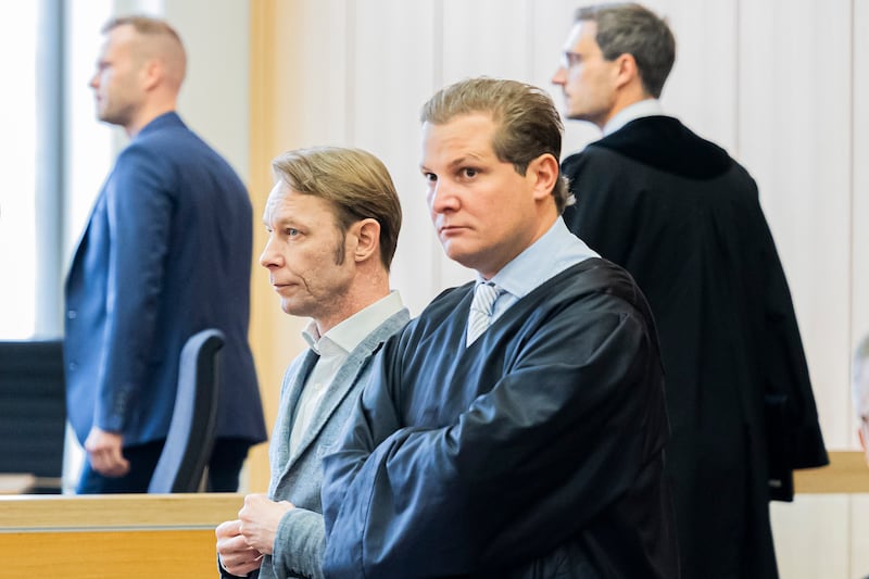 Christian Brueckner, centre, has been cleared of sex offences after a trial in Germany (Michael Matthey/dpa/AP)