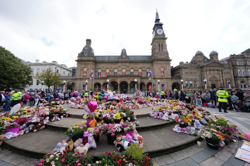 Flowers and tributes outside the Atkinson Art Centre in Southport