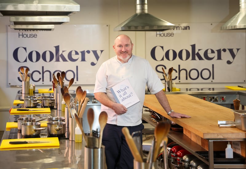 Belfast restaurateur Niall McKenna with his new book. PICTURE: MAL MCCANN