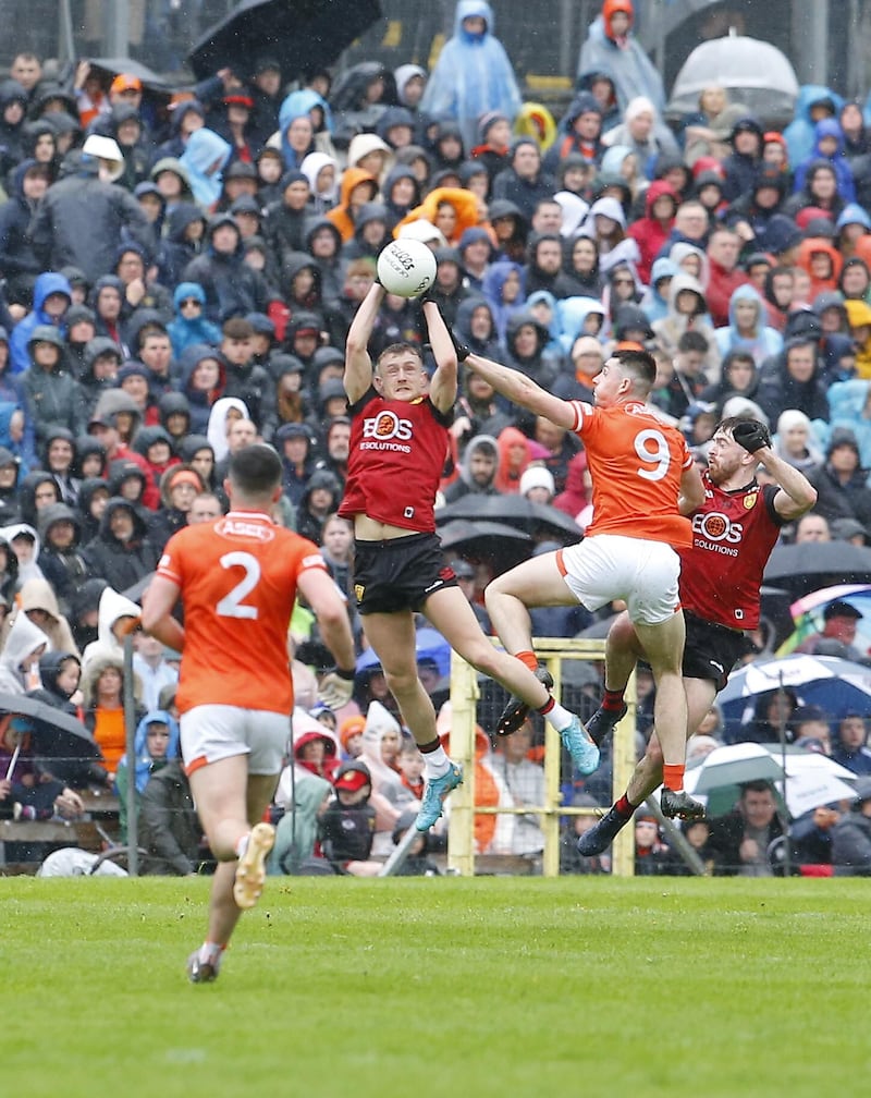 A rare moment of midfield succcess for Down against Armagh on Sunday. Pic: Philip Walsh