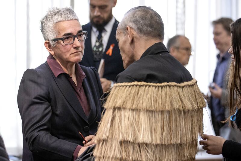 Solicitor-General Una Jagose, left, speaks with survivor Toni Jarvis following Prime Minister Christopher Luxon’s ‘formal and unreserved’ apology in Parliament (Monique Ford/Stuff/AP)