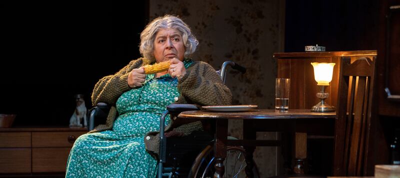 Miriam Margolyes playing an elderly lady sitting eating a corn on the cob