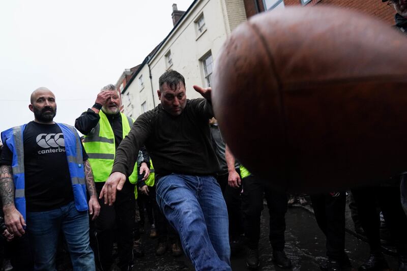 One man was seen enthusiastically kicking the ball