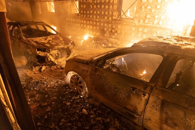 Burnt-out cars in a residential area of Kharkiv after a Russian attack (Yevhen Titov/AP)