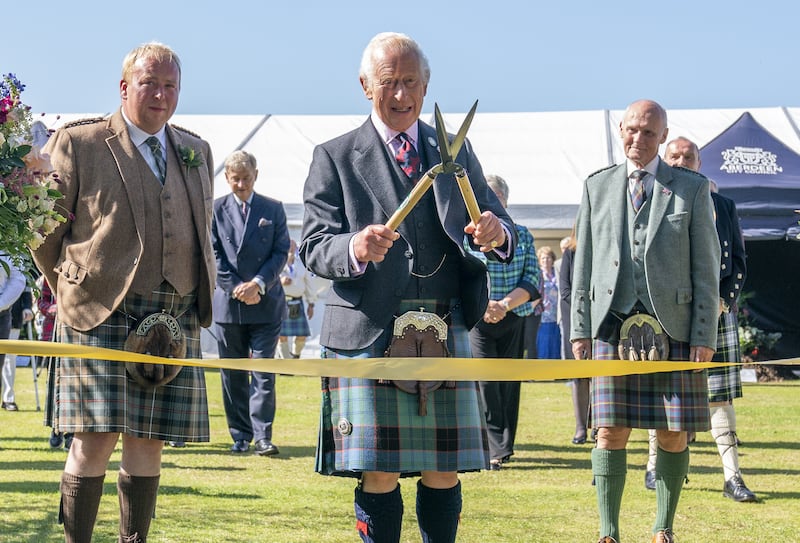 The King uses a pair of gardening shears to officially open the Royal Horticultural Society of Aberdeen’s 200th Flower Show at Duthie Park, Aberdeen