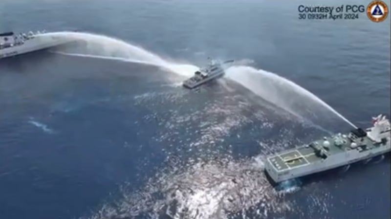 The Philippine Coast Guard and the Chinese Coast Guards have clashed over the disputed shoal, with some altercations including the firing of water cannon (Philippine Coast Guard/AP)
