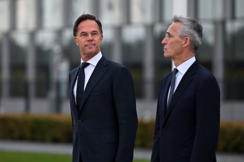 Mark Rutte, left, and Jens Stoltenberg attended a wreath-laying ceremony at Nato headquarters in Brussels on Tuesday (Harry Nakos/AP)