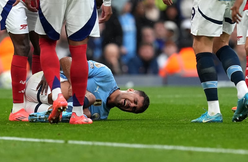 Rodri lies injured against Arsenal