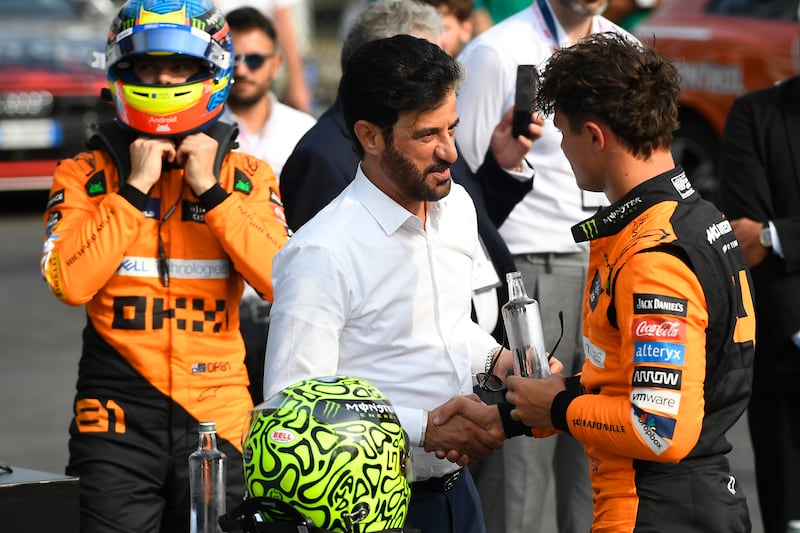 Lando Norris is congratulated by FIA President Mohammed Ben Sulayem (Massimo Pinca/Pool Photo via AP)