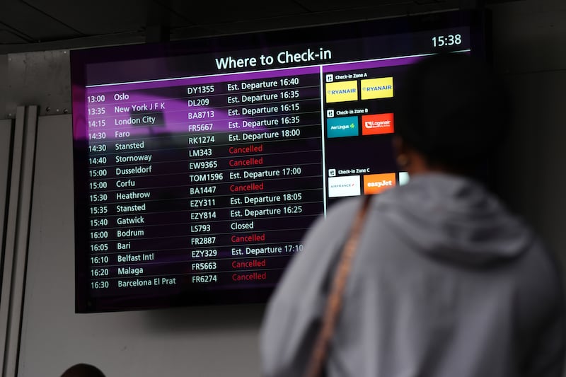 A person views a check-in display at Edinburgh Airport