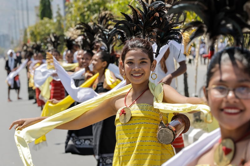 Participants gather on a road as they wait for the arrival of Pope Francis before the welcoming ceremony outside the Presidential Palace in Dili, East Timor (Yasuyoshi Chiba/Pool photo via AP)