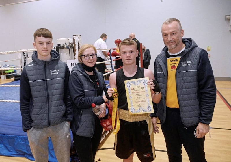 Padraig Scott celebrates winning his Boy 1 50kg Ulster open title with brother Aodhan, mum Bridget and dad Malachy. The Ulster 9 County Boy/Girl 123 championships took place at the Shantallow Community Centre in Derry over the weekend. Picture by Mark Marlow 