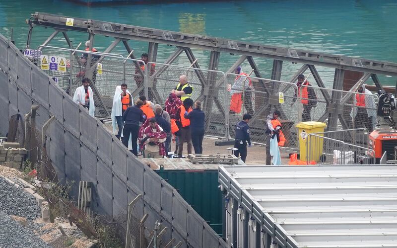 A group of people thought to be migrants being brought in to Dover from a Border Force vessel on Wednesday