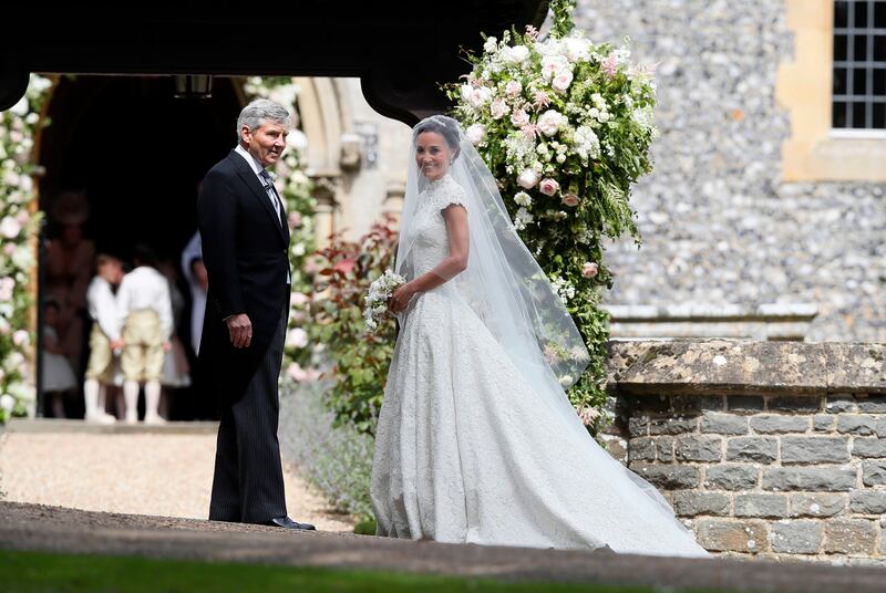 Pippa Middleton wore a caped sleeve full lace dress by British wedding designer, Giled Deacon, in 2017