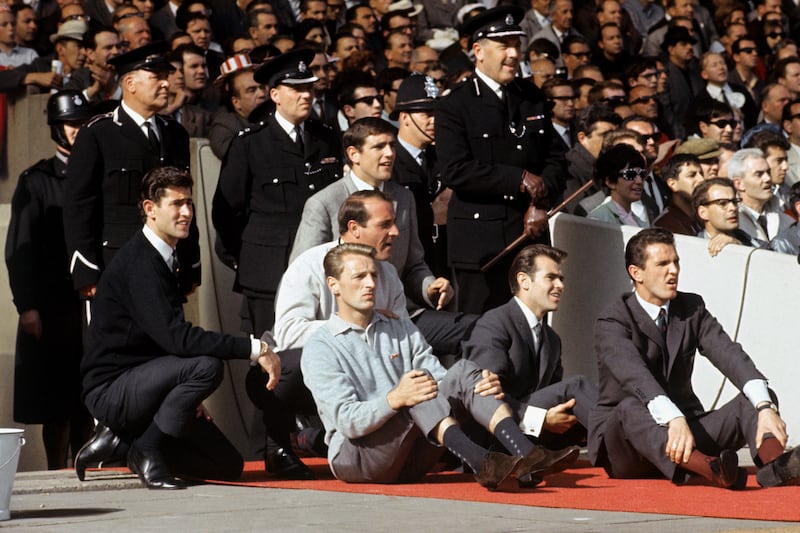 George Eastham (left, on the floor) watches England’s World Cup final victory