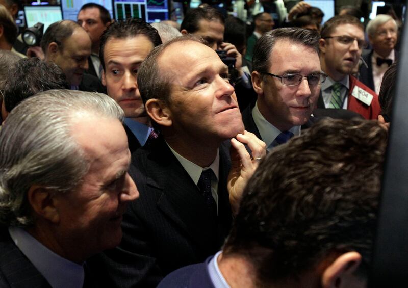 David Calhoun, centre, is stepping down at the end of the year (AP Photo/Richard Drew, File)