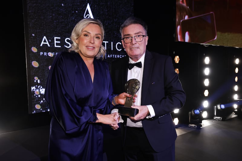 Lauren McConville's mother, Michelle, accepting the Ladies' Footballer of the Year award on behalf of her daughter at The Irish News Ulster All-Stars 2024 at the ICC Belfast