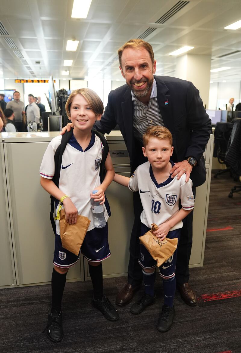 Gareth Southgate with young fans at the BGC annual charity day at Canary Wharf in London