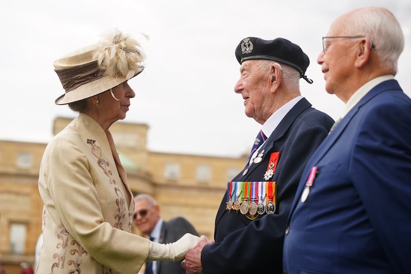 The Princess Royal spoke to D-Day veterans at a garden party at Buckingham Palace