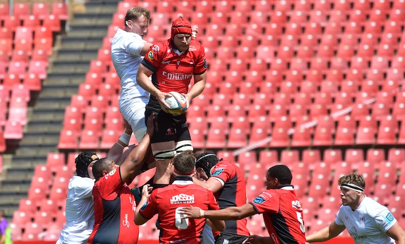 Player in red catches rugby lineout