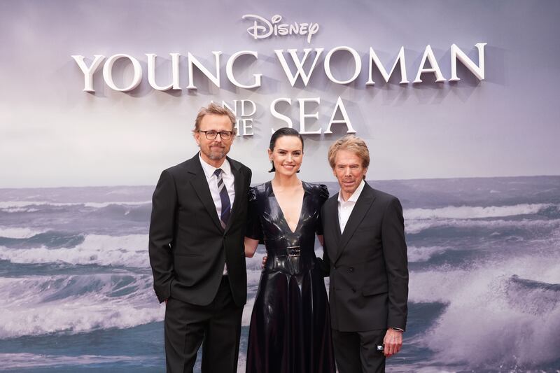 Joachim Ronning, Daisy Ridley and Jerry Bruckheimer attend the gala screening of Young Woman And The Sea