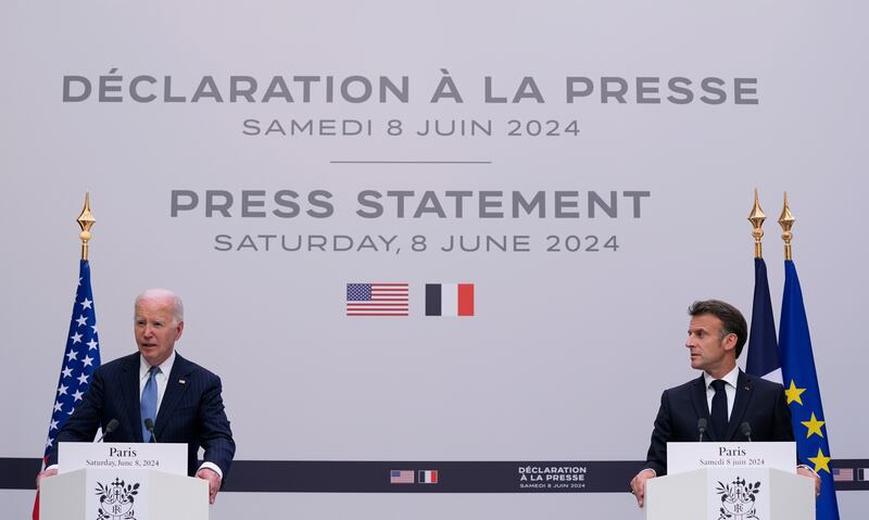 French President Emmanuel Macron listens to US President Joe Biden (Evan Vucci/AP)