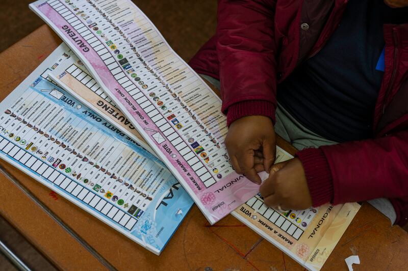 An election official prepares the ballots for the general elections in Soweto, South Africa (Jerome Delay/AP)