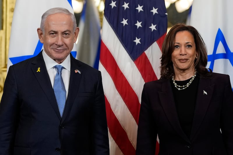 Mr Netanyahu with Vice President Kamala Harris (Julia Nikhinson/AP)