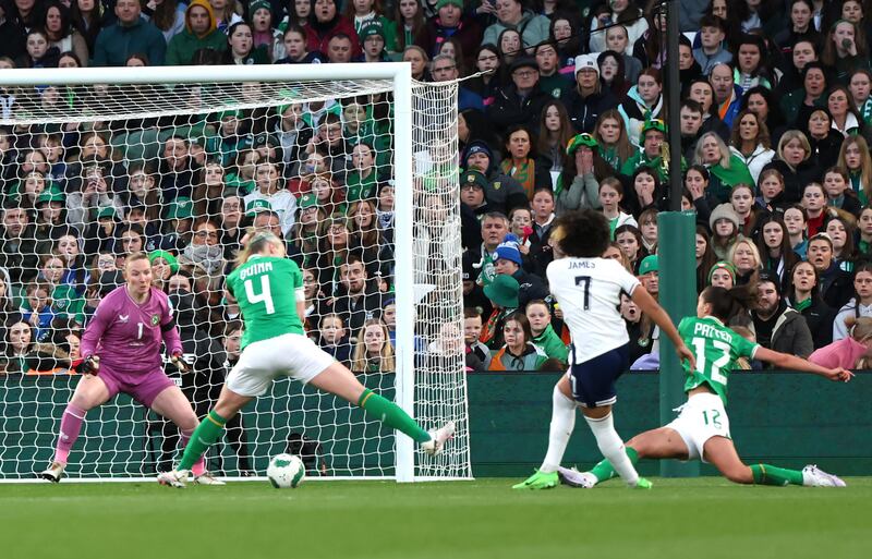 Lauren James, second right, fires home England’s first goal