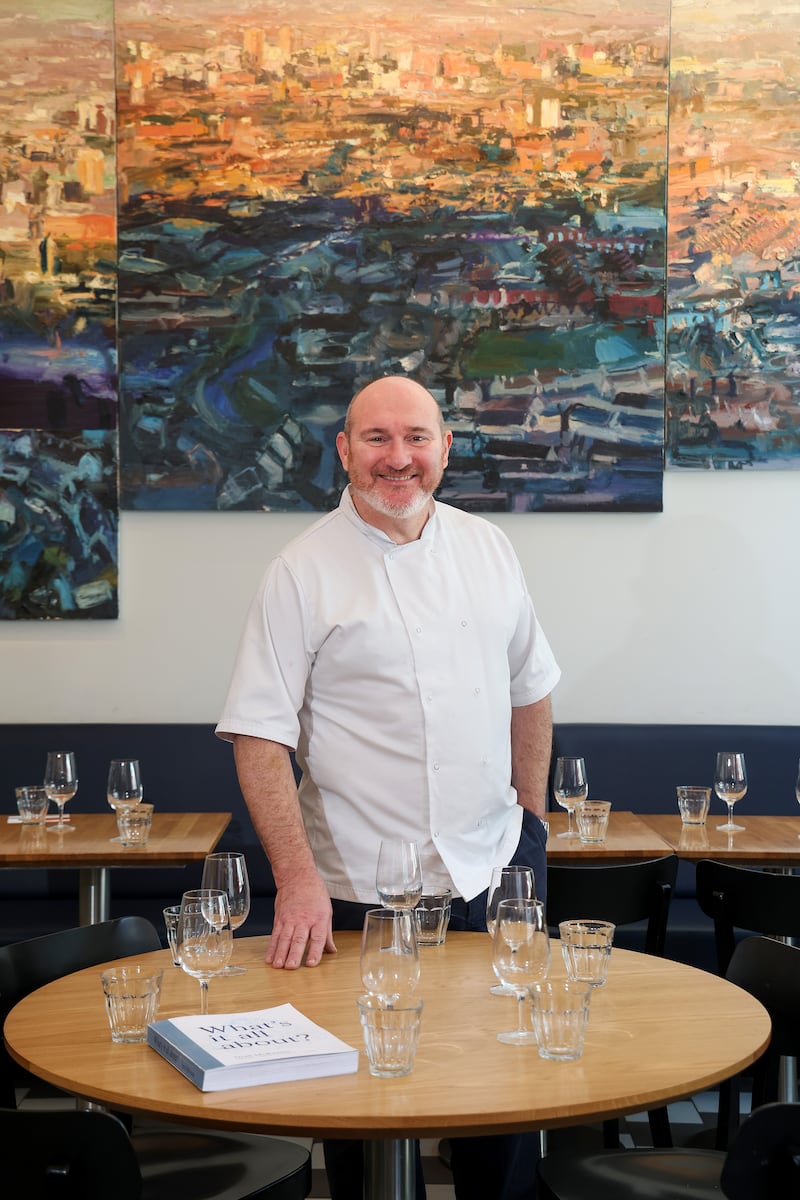 Belfast restaurateur Niall McKenna with his new book. PICTURE: MAL MCCANN