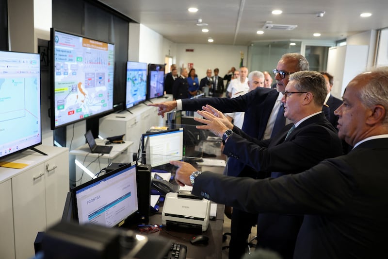 Sir Keir looks at screens showing maritime traffic off the Italian coast with Italian Minister of the Interior Matteo Piantedosi and Chief of Italian Border Police Claudio Galzerano