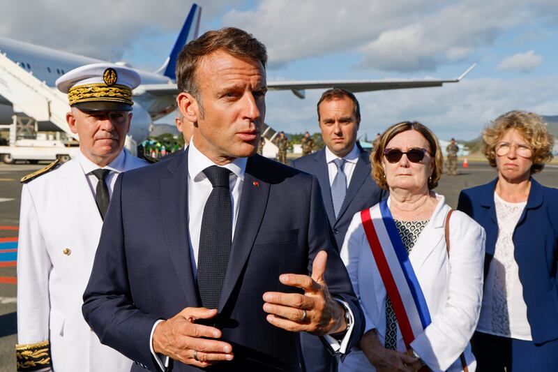 French President Emmanuel Macron at Noumea La Tontouta International airport in New Caledonia (Ludovic Marin/Pool Photo via AP)