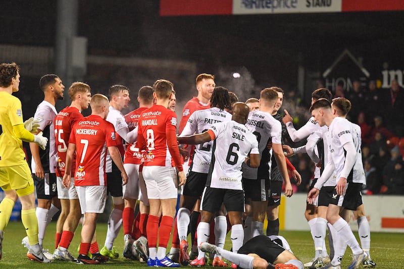 Players of Larne and Glentoran come together during this evening’s final at Seaview Stadium, Belfast