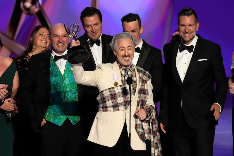 Alan Cumming and the team from The Traitors accept the award for outstanding reality competition program during the 76th Primetime Emmy Awards (AP Photo/Chris Pizzello)