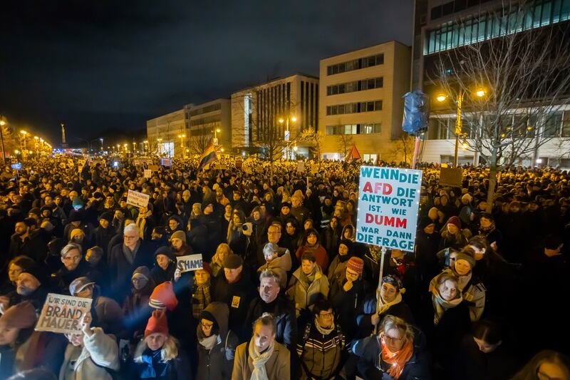 People protest in front of the headquarters of the Christian Democratic Union party against a migration vote at Bundestag (Christoph Soeder/dpa via AP)