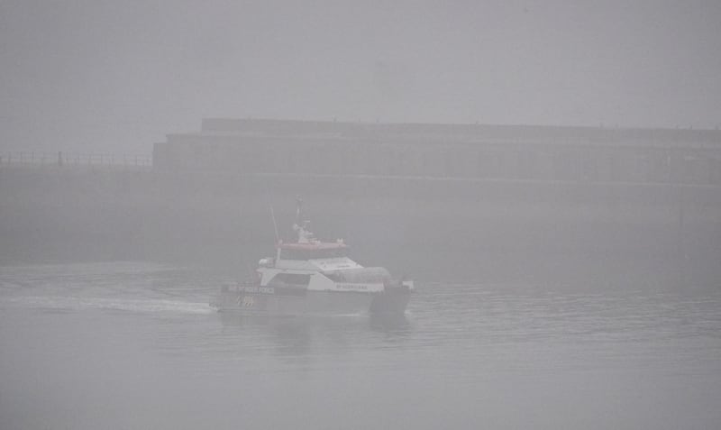 A group of people thought to be migrants are brought in to Dover, Kent, by a Border Force vessel in misty conditions