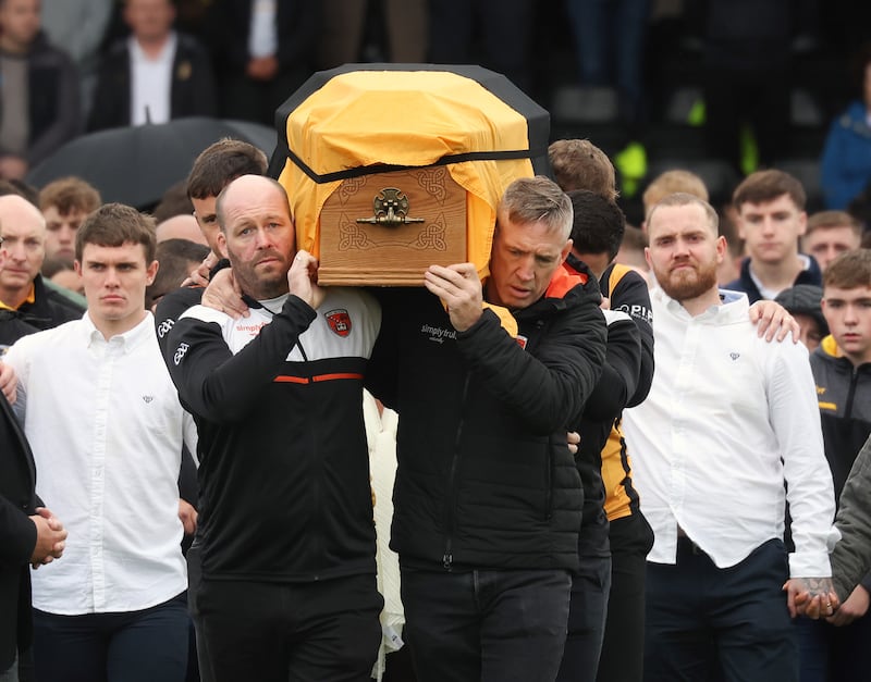 Armagh Manager   Kieran McGeeney And Ciaran McKeever  carry the coffin of Crossmaglen Rangers player Caolan Finnegan during his funeral on Monday, Caolan received a lap of honour at Crossmaglen ground before the funeral at St Patrick’s Church.
PICTURE COLM LENAGHAN