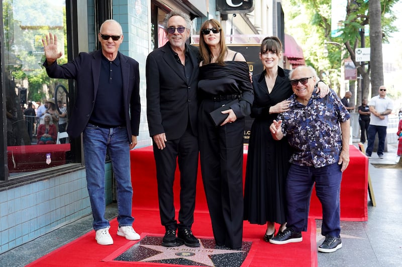 Michael Keaton, Tim Burton, Monica Bellucci, Winona Ryder and Danny DeVito at a ceremony honouring Burton with a star on the Hollywood Walk of Fame (Jordan Strauss/Invision/AP)