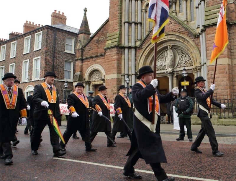 Orangemen in traditional bowler hats marching towards Belfast city centre. Picture by Cliff Donaldson