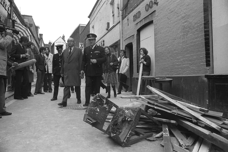 The Home Secretary Roy Jenkins (l), accompanied by Peter Matthews, the Chief Constable of Surrey, leaves the Seven Stars public house, one of the pubs bombed in Guildford