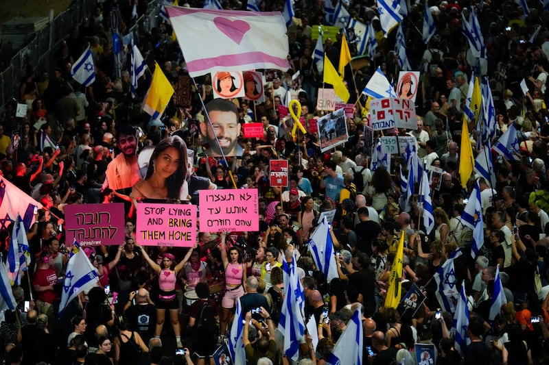 People protest against Prime Minister Benjamin Netanyahu’s government and call for the release of hostages held in the Gaza Strip by the Hamas militant group, in Tel Aviv, Israel, Saturday, Sept. 7, 2024. (AP Photo/Ariel Schalit)