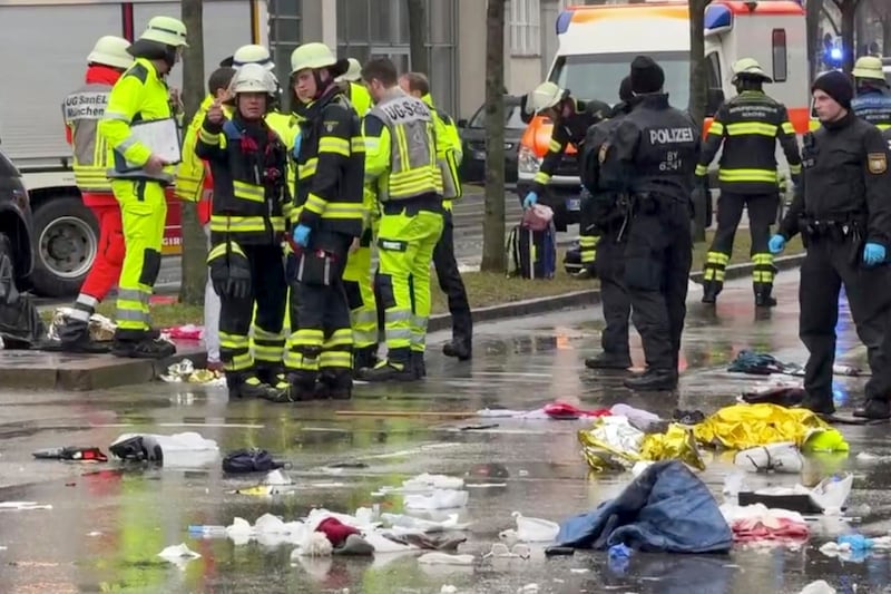 Emergency services attend the scene of an accident after a car hit a group of people in Munich, Germany (Peter Kneffel/dpa via AP)