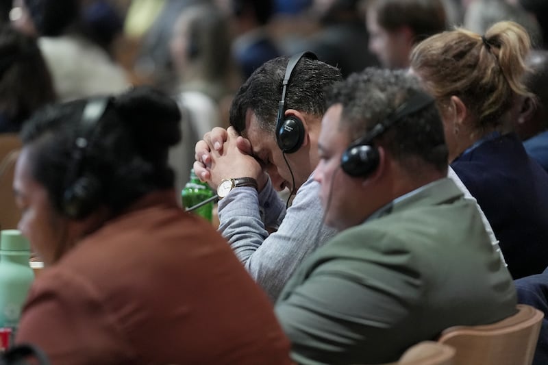 Attendees listen to a closing plenary session at the Cop29 (Joshua A Bickel/AP)