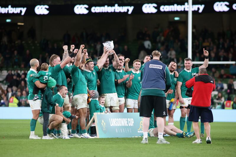 Ireland players lift the Lansdowne Cup following the win over Australia