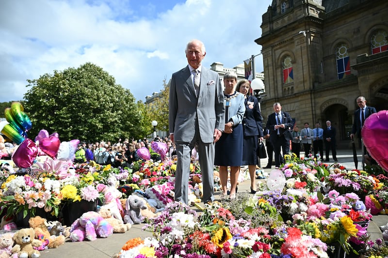 Charles took time to view tributes as he visited Southport