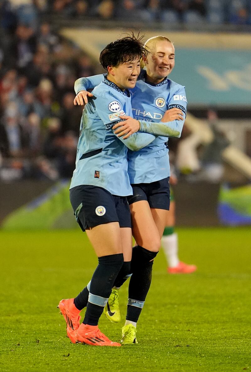 Aoba Fujino, left, celebrates with fellow goalscorer Laura Blindkilde Brown after scoring Manchester City’s second goal