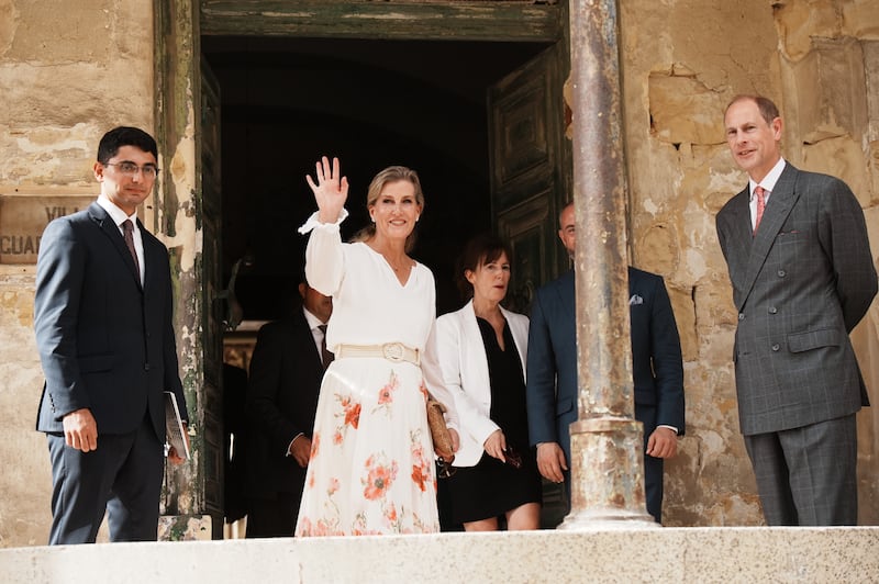 The duchess waved to a small crowd that had gathered outside the villa