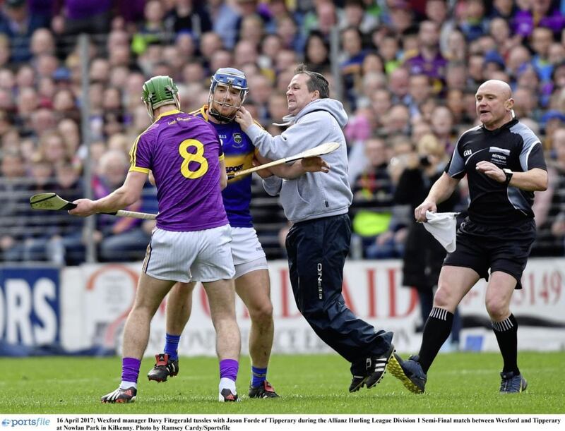 Wexford manager Davy Fitzgerald tussles with Jason Forde of Tipperary during the Allianz Hurling League Division 1 semi-final at Nowlan Park, Kilkenny. 