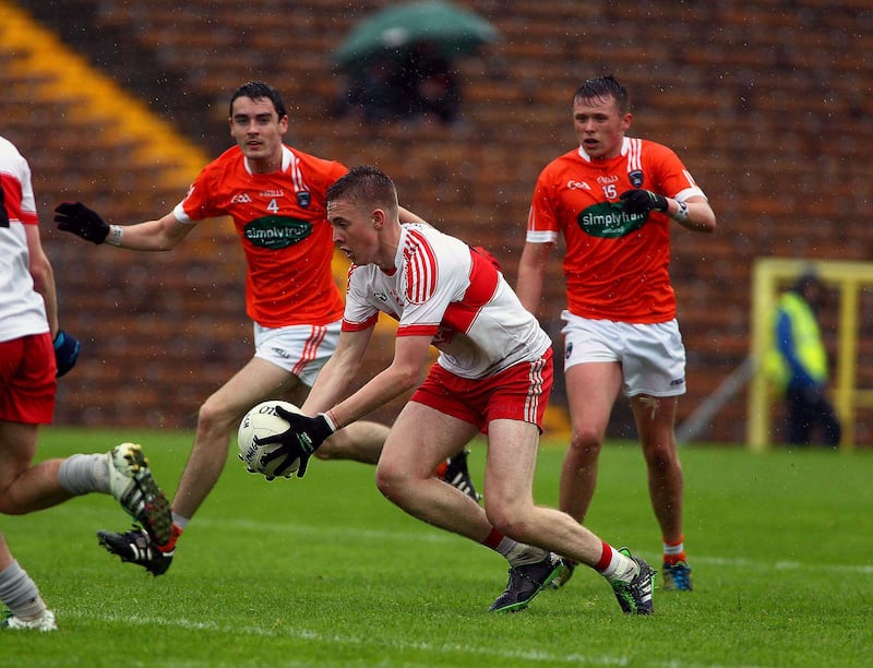 Derry's Oisin McWilliams gets away from Armagh's Declan Loye and Ryan McSherry during the Ulster minor semi-final at Clones <br />Picture by Seamus Loughran&nbsp;