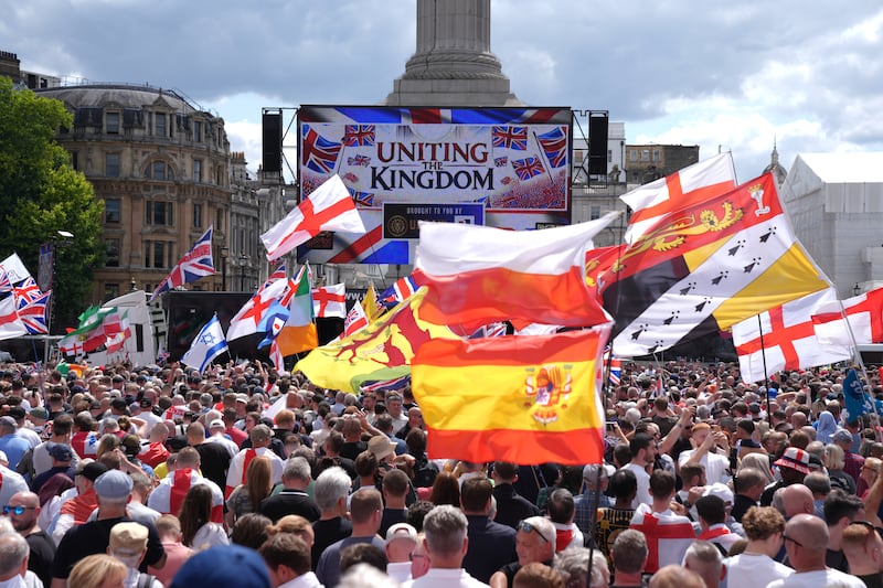 People gather at Trafalgar Square during a rally organised by Tommy Robinson